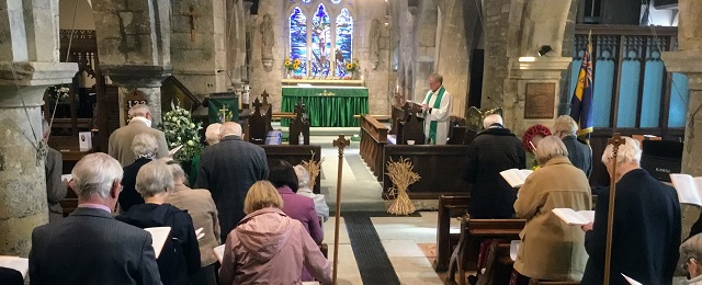 The inside of St Nicholas Church during worship